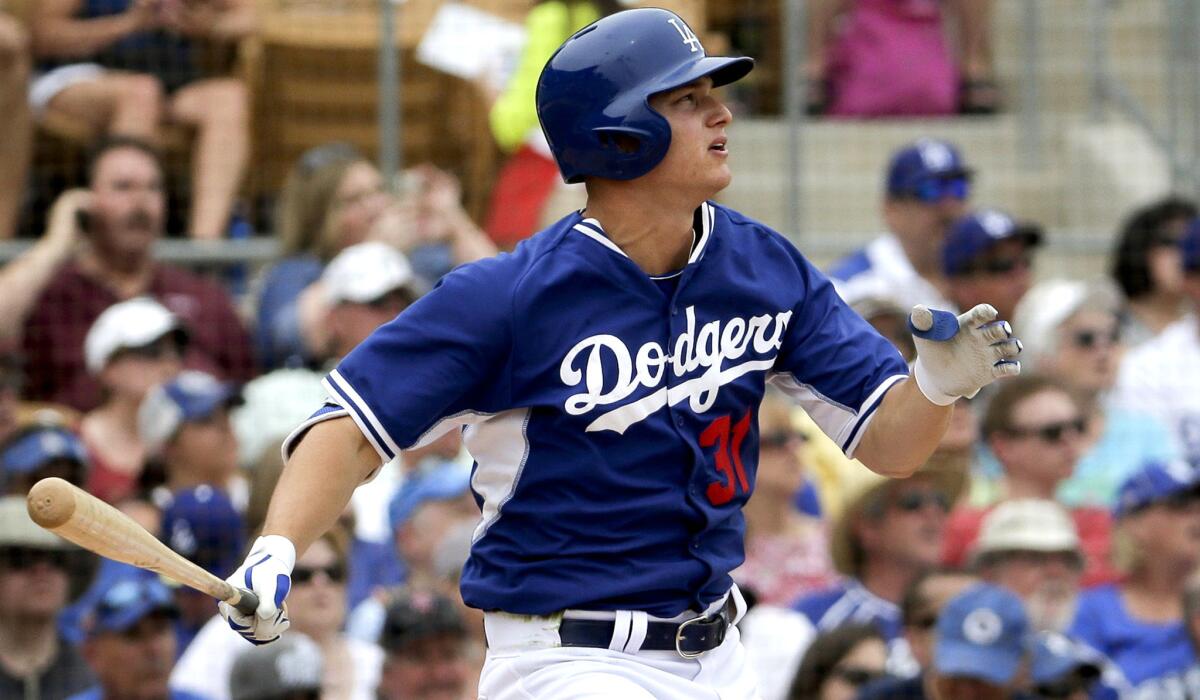 Dodgers center fielder Joc Pederson watches his three-run home run against the Chicago Cubs during the second inning of a spring training game on Wednesday in Glendale, Ariz.
