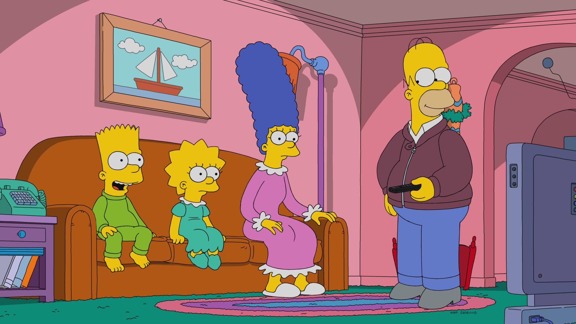 Bart, Lisa and Marge sitting on a sofa with Homer standing nearby