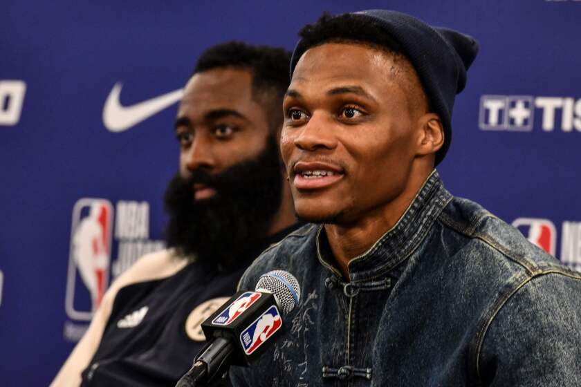 Houston's guard Russel Westbrook (R) answers questions beside James Harden (L) during a press conference after the NBA Japan Games 2019 pre-season basketball match between Houston Rockets and Toronto Raptors in Saitama, northern suburb of Tokyo on October 10, 2019. (Photo by TOSHIFUMI KITAMURA / AFP) (Photo by TOSHIFUMI KITAMURA/AFP via Getty Images)
