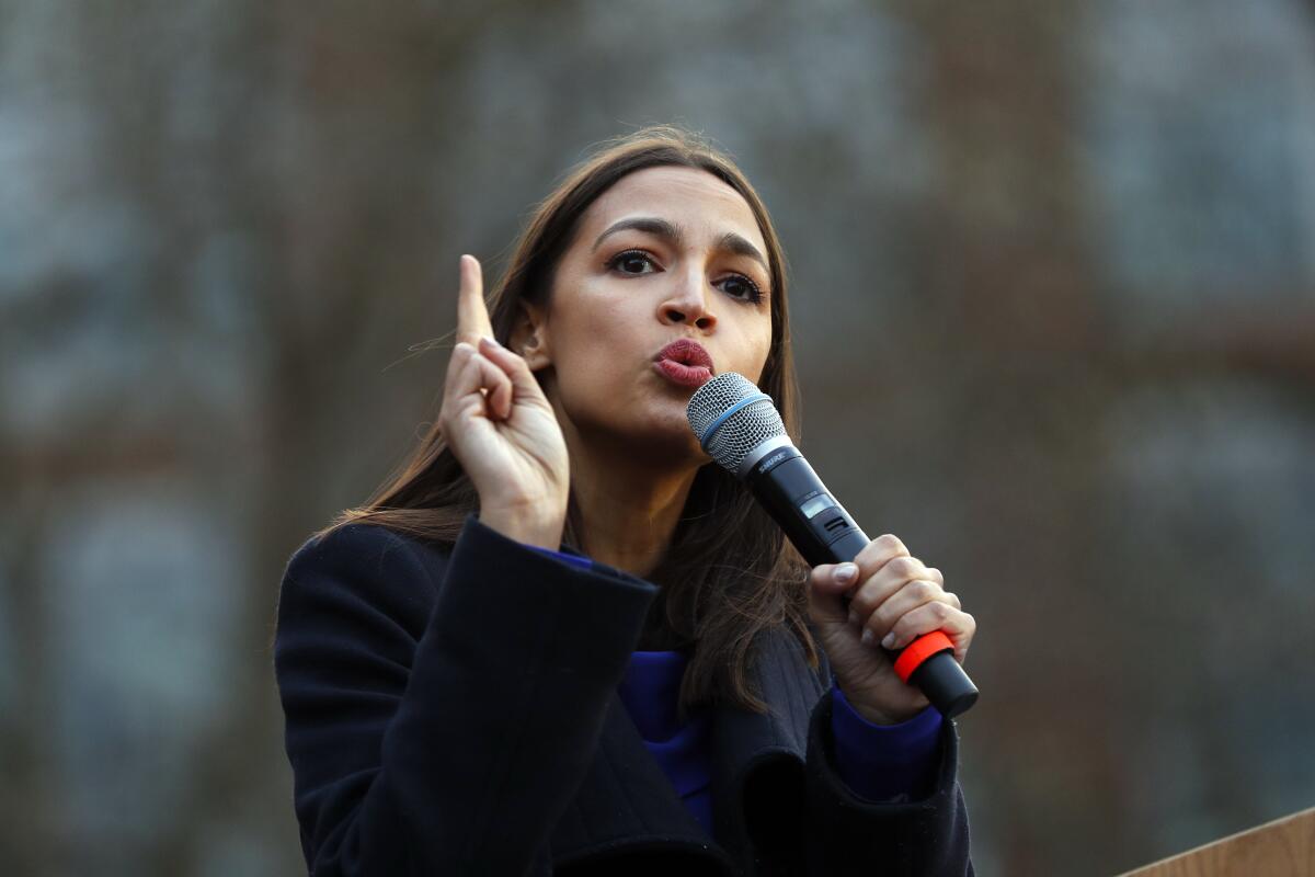 Rep. Alexandria Ocasio-Cortez speaks at a March campaign rally for Bernie Sanders.