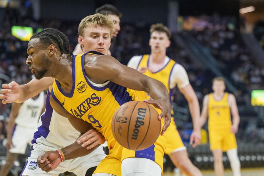 Los Angeles Lakers guard Bronny James (9) drives toward the basket during the second half of an NBA summer league basketball game against the Sacramento Kings in San Francisco , Saturday, July 6, 2024. (AP Photo/Nic Coury)