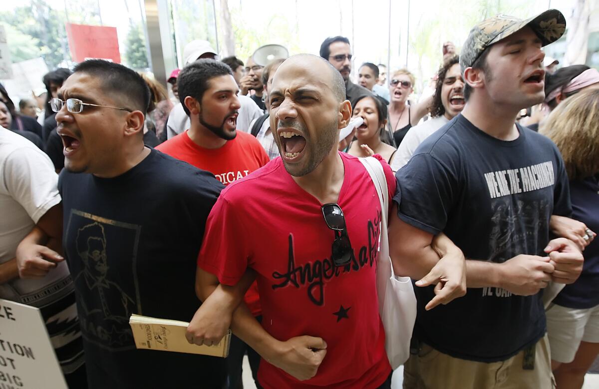 Demonstrators gathered in the Glenn S. Dumke Auditorium as the California State University trustees met in 2009 to vote on faculty furloughs and student fee hikes.