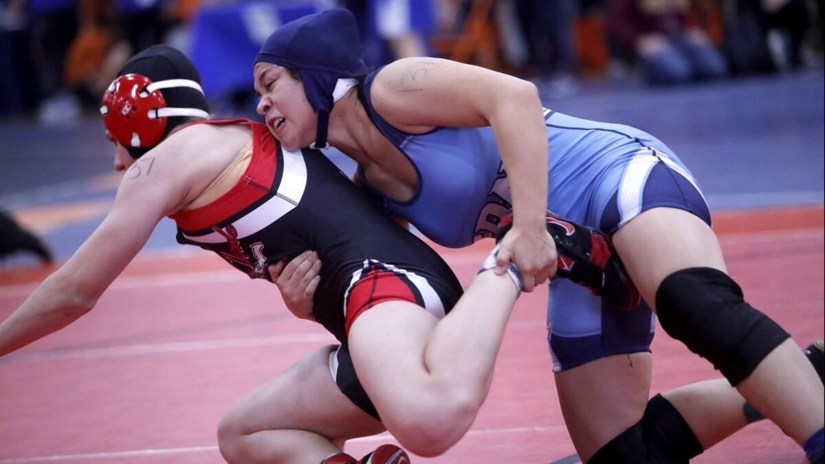 Corona del Mar High's Kiersten Muse, right, battles Rancho Verde's Vanessa Gonzalez in the CIF Southern Section girls' wrestling finals at Eastvale Roosevelt High on Feb. 9, 2018.