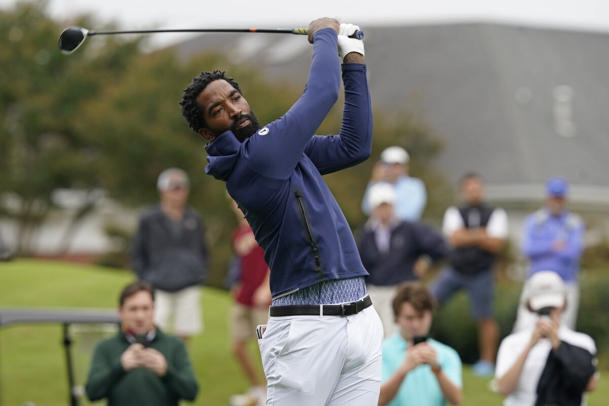North Carolina A&T's J.R. Smith tees off on the first hole during the first round of the Phoenix Invitational golf tournament in Burlington, N.C., Monday, Oct. 11, 2021. Smith, who spent 16 years in the NBA, made his college golfing debut in the tournament hosted by Elon. (AP Photo/Gerry Broome)