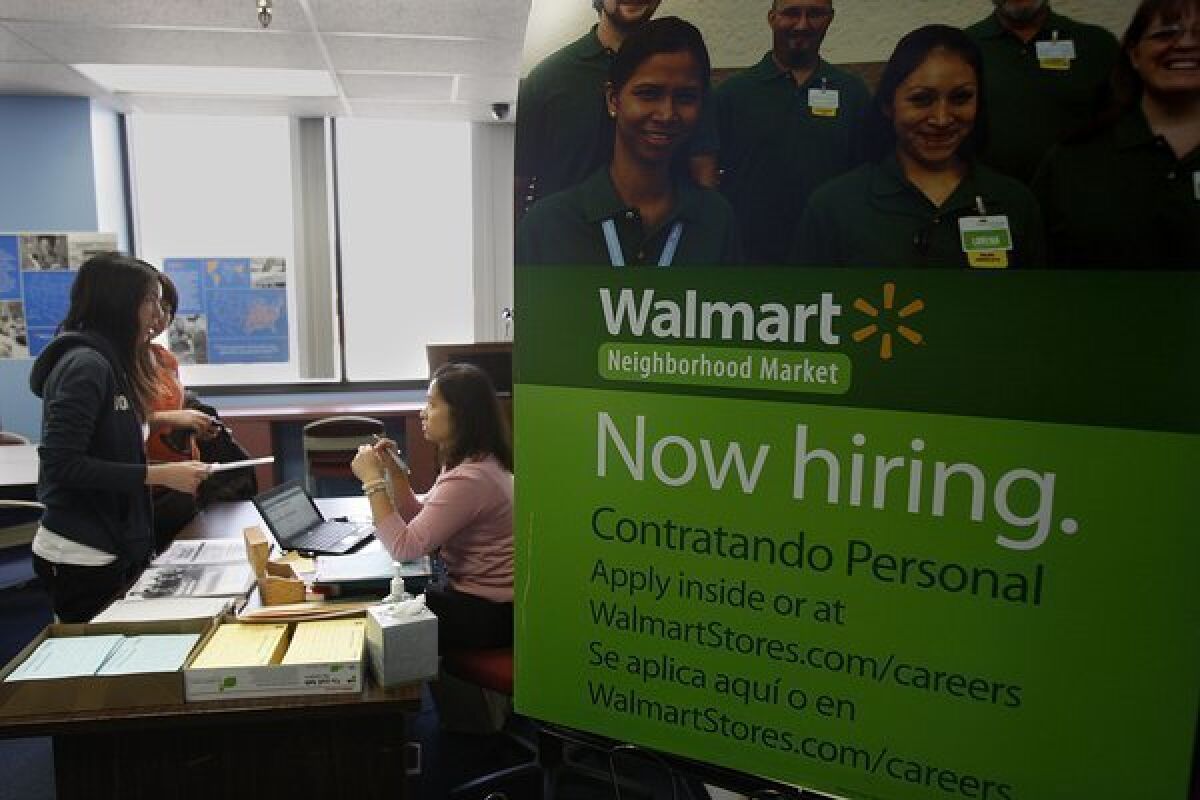 Wal-Mart has been taking applications for a new story it's planning in Chinatown, but a slump in overall sales could lead to a slowdown in hiring for the retailer.