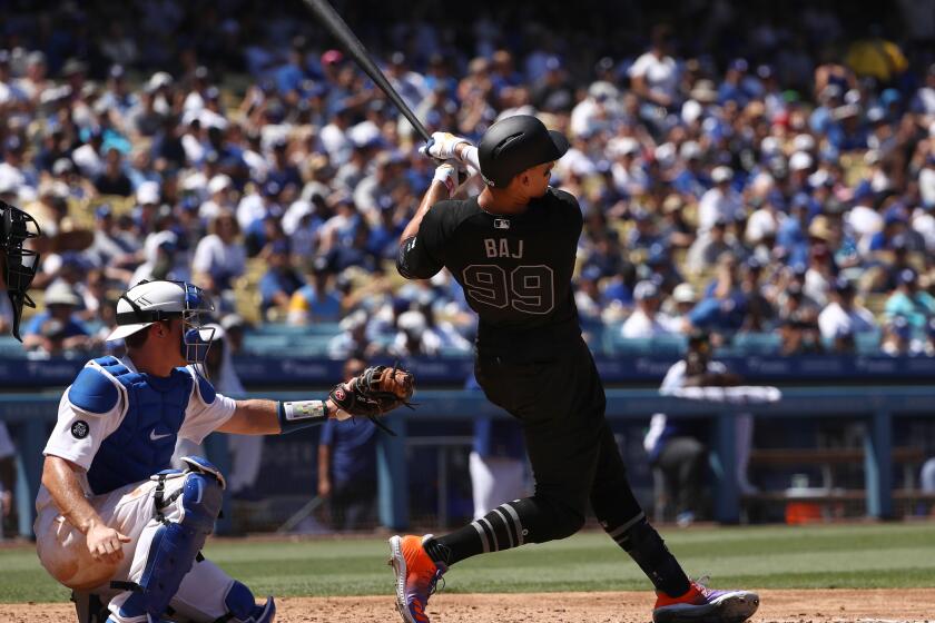 LOS ANGELES, CALIFORNIA - AUGUST 24: Aaron Judge #99 of the New York Yankees hits a solo home run during the fourth inning of the MLB game against the Los Angeles Dodgers at Dodger Stadium on August 24, 2019 in Los Angeles, California. Teams are wearing special color-schemed uniforms with players choosing nicknames to display for Players' Weekend. (Photo by Victor Decolongon/Getty Images)