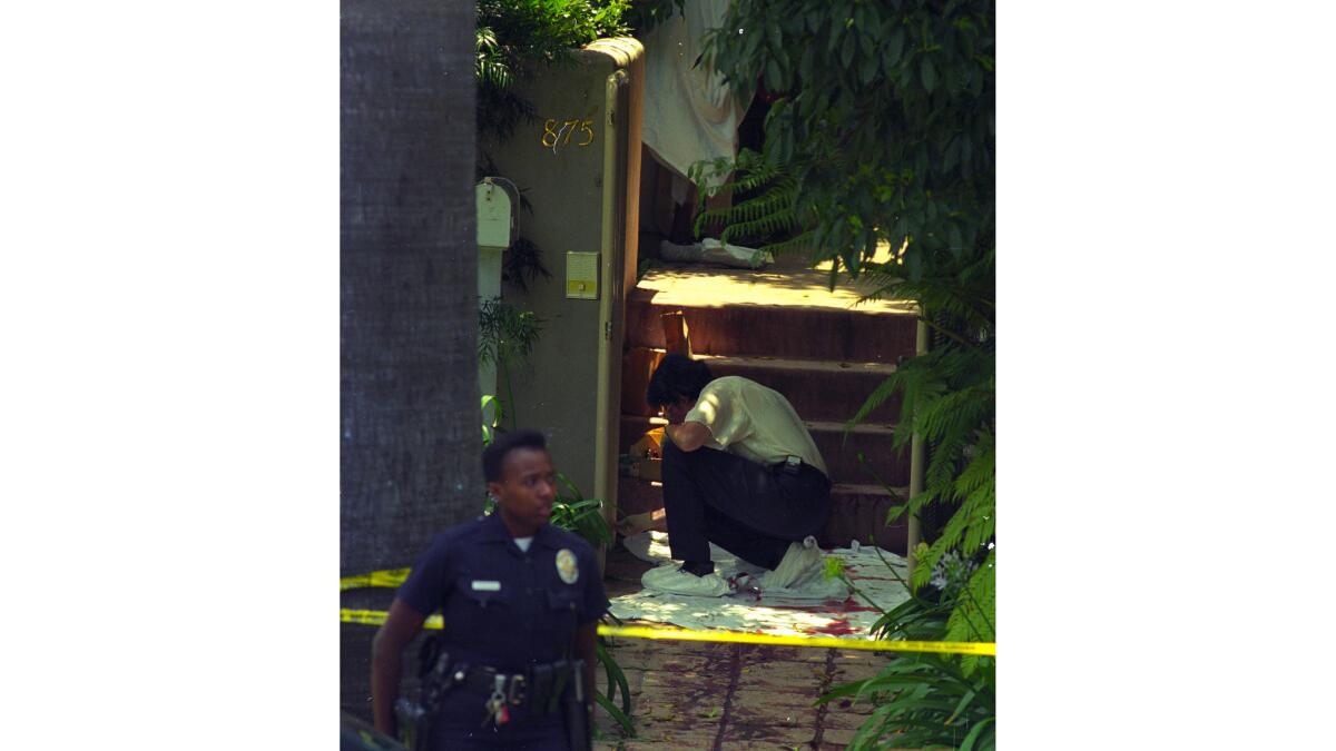 Nicole Brown Simpson's body was found outside her home at 875 S. Bundy Drive in Brentwood. Police examine the area where her body was found.