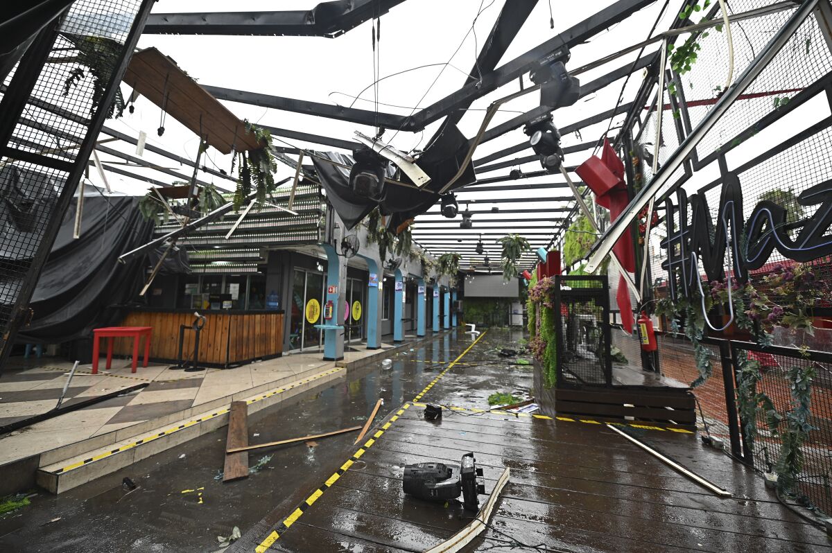 A commercial area is damaged after the passing of Hurricane Pamela in Mazatlan, Mexico, Wednesday, Oct. 13, 2021. Hurricane Pamela made landfall on Mexico's Pacific coast just north of Mazatlan on Wednesday, bringing high winds and rain to the port city. (AP Photo/Roberto Echeagaray)