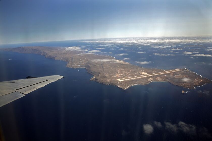 San Clemente Island, viewed from a shuttle aircraft that regularly flies military and civilian personnel to the U.S. Navy-owned land mass 68 miles from San Diego. The military airstrip is seen at the northern end. The southern end has the only remaining ship-to-shore bombardment range in the U.S. The Navy has supported an extensive ecological restoration of endangered plants and animals on the island. [For the record, July 24, 2013: An earlier version of this caption incorrectly said the military airstrip was at the southern end of the island, and the bombardment range to the north.]