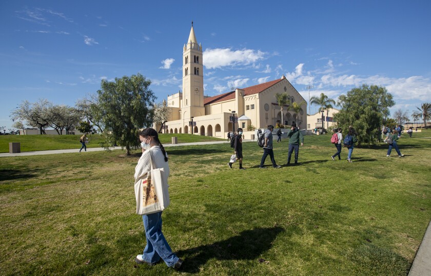 Huntington Beach High School students leave campus after attending hybrid instruction on Feb. 2.