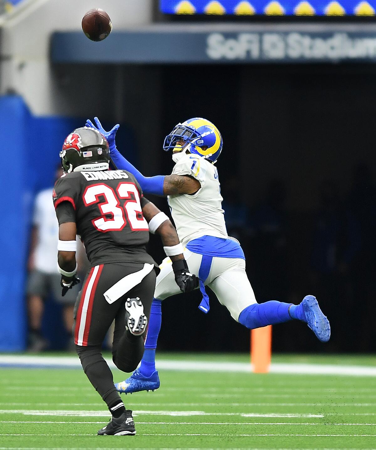 Rams receiver DeSean Jackson catches a 75-yard touchdown pass behind Bucaneers safety Mike Edwards.