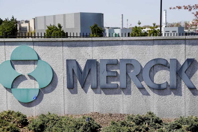 FILE- This May 1, 2018, file photo shows Merck corporate headquarters in Kenilworth, N.J. Merck posted a big fourth-quarter loss, mainly due to much higher spending on research, production and overhead, and announced longtime chief executive, Kenneth Frazier, will retire on July 1, 2021. (AP Photo/Seth Wenig, File)