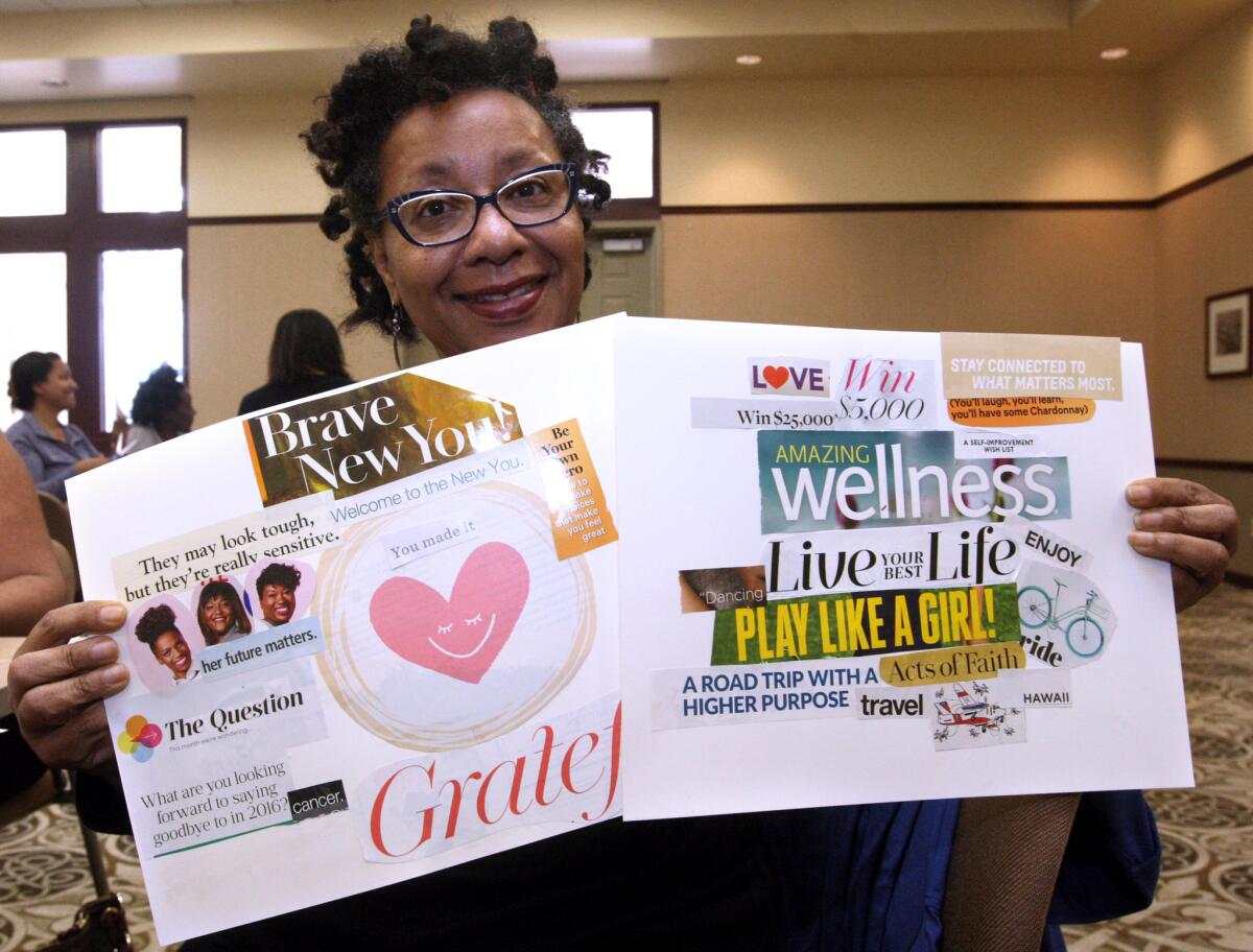 Bernadette Woodson, of Burbank, shows off the progress of her vision boards at the Buena Vista Branch of the Burbank Library on Saturday, Jan. 16, 2016. After battling two cancer diagnoses put her life “on hold” last year, Woodson said she wants to focus on getting back into the swing of things.