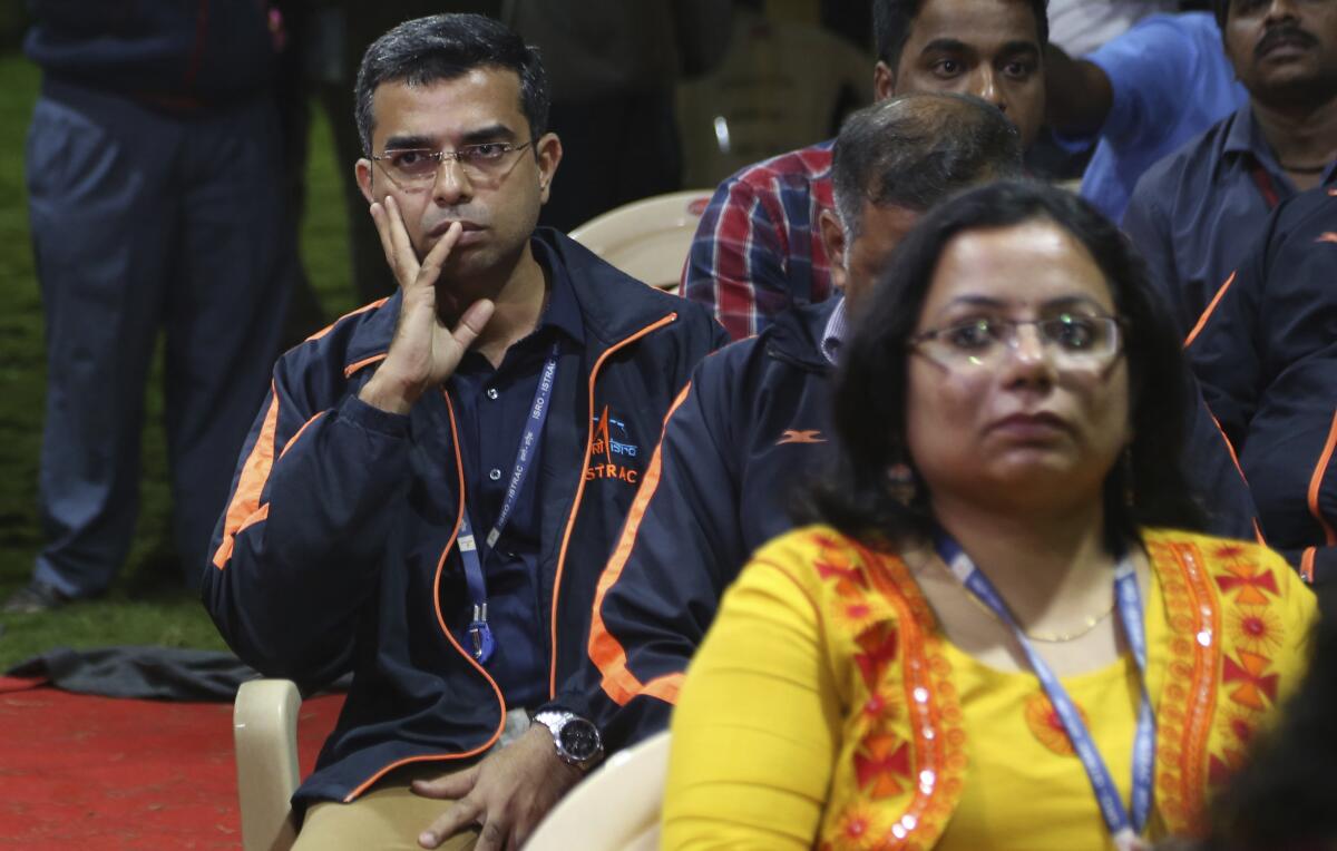 Indian Space Research Organization (ISRO) employees react as they wait for an announcement by organizations's chief Kailasavadivoo Sivan at its Telemetry, Tracking and Command Network facility in Bangalore, India, Saturday, Sept. 7, 2019. India's space agency says it has lost communication with its unmanned spacecraft that was set to touch down Saturday on the moon's south pole. (AP Photo/Aijaz Rahi)
