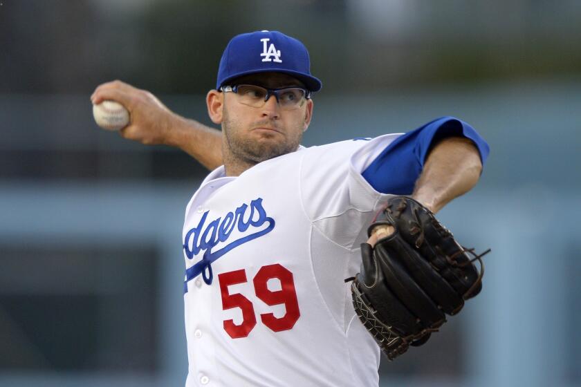 Dodgers starting pitcher Stephen Fife throws to the plate during the first inning against the Atlanta Braves.