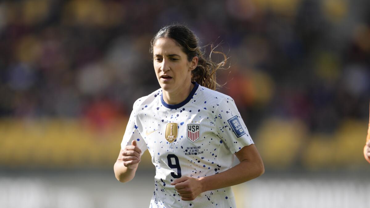 U.S. midfielder Savannah DeMelo runs across the pitch during a World Cup Group E match against the Netherlands.