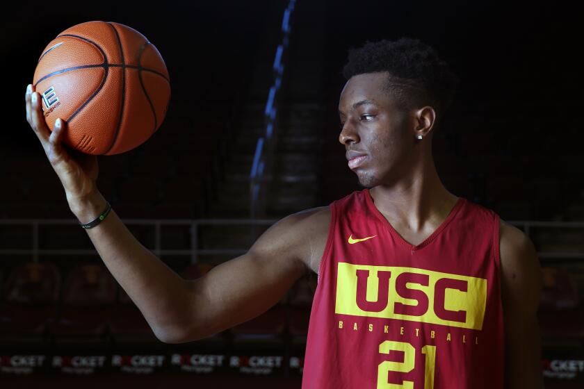 LOS ANGELES, CA-DECEMBER 31, 2019: USC freshman basketball player Onyka Okongwu, a potential top-10 draft pick this summer, stands for a portrait after practice on December 31, 2019, at the USC Galen Center in Los Angeles, California. He wears a bracelet and the No. 21 jersey that honors his brother who died in 2014 after a skateboarding accident. (Photo By Dania Maxwell / Los Angeles Times)