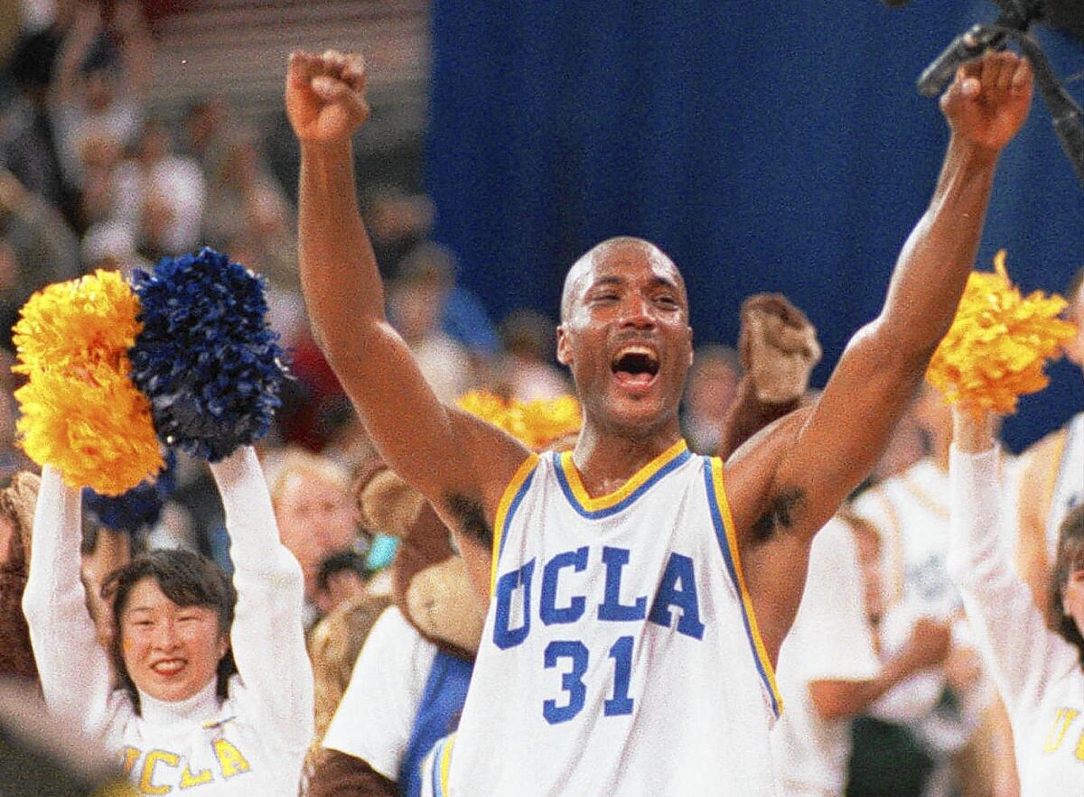 Ed O'Bannon celebrates UCLA's NCAA title victory over Arkansas on April 3, 1995.