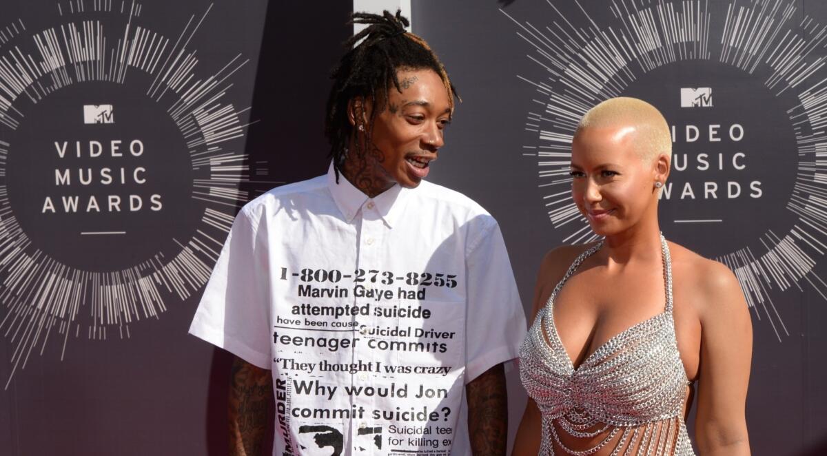 Wiz Khalifa and Amber Rose arrive on the red carpet at the MTV Video Music Awards at the Forum in Inglewood on Aug. 24.