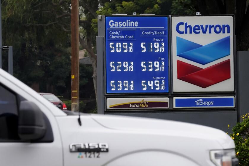 FILE - Chevron gas prices are displayed in Visalia, Calif., Tuesday, Nov. 16, 2021. State regulators say Chevron is the only one of the state's big five oil companies to not fully comply with a new state law requiring them to disclose data on pricing. (AP Photo/Rich Pedroncelli, File)