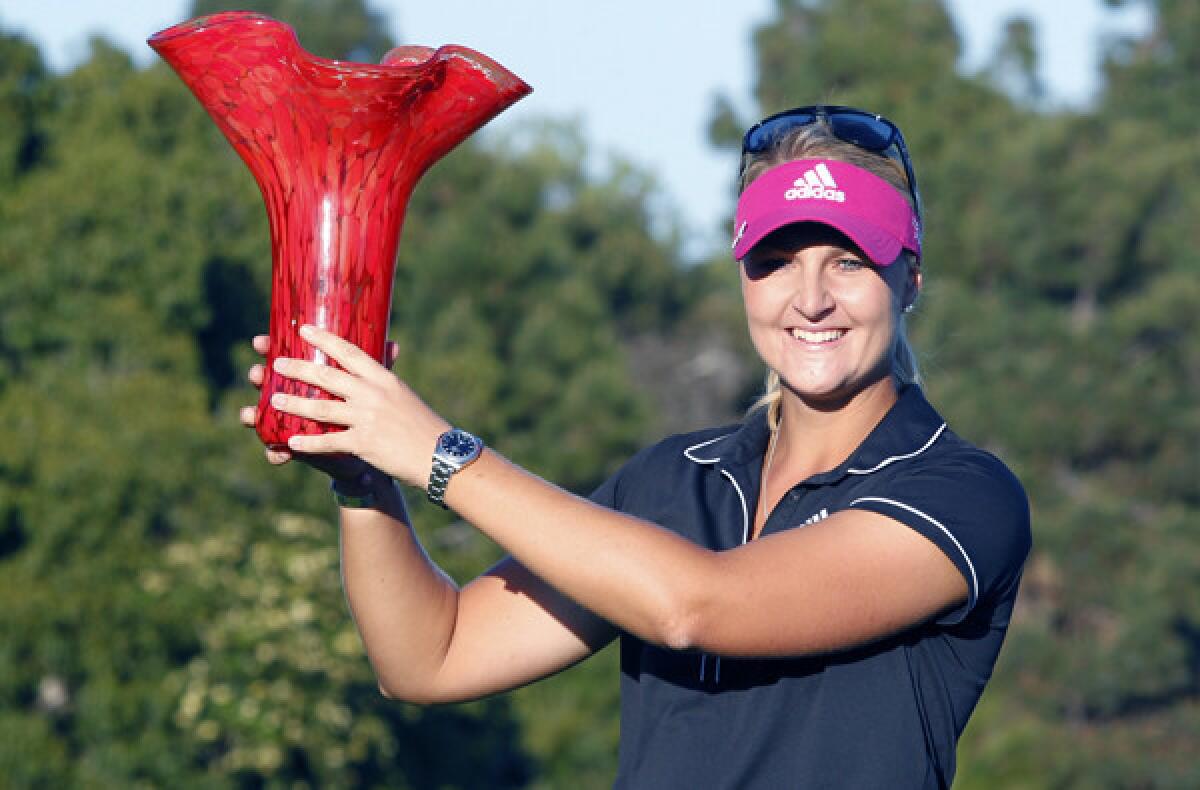 Anna Nordqvist poses for photos with the winner's trophy after her victory in the Kia Classic on Sunday.