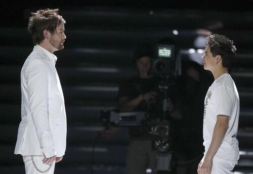 David Cook, left, and David Archuleta meet on stage during the opening of the season finale of "American Idol."