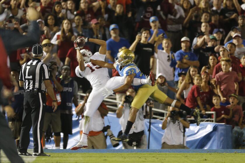 Stanford receiver JJ Arcega-Whiteside (19) catches the game-winning touchdown against UCLA defensive back Nate Meadors (22) during a game at the Rose Bowl on Sept. 24.