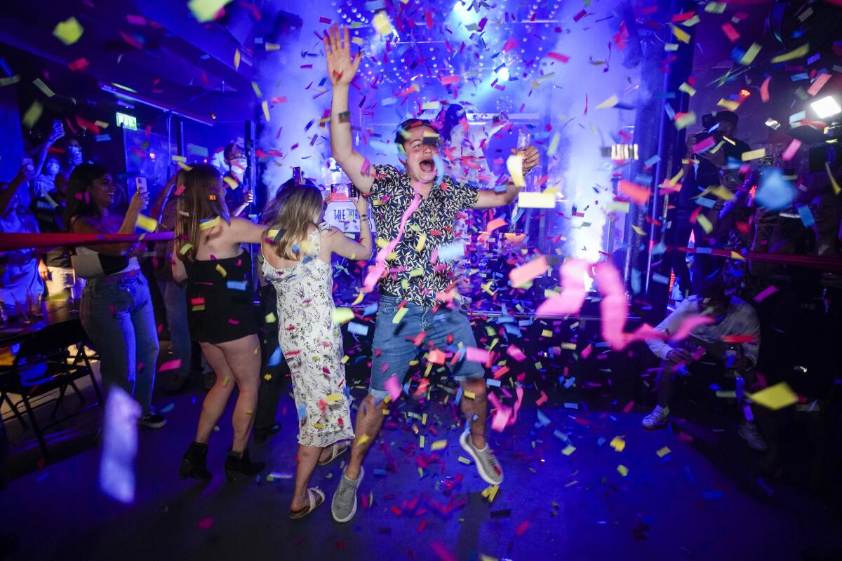 Man jumping on dance floor at London nightclub