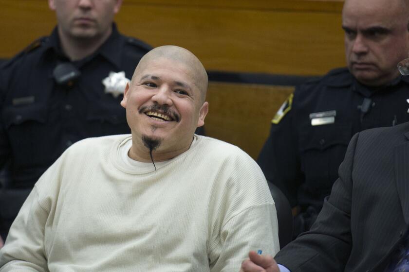 Luis Bracamontes smiles as the verdict is read that he will receive the death penalty in the murders of Sacramento Sheriff's Deputy Danny Oliver and Placer County Det. Michael Davis Jr., Tuesday, March 27, 2018, in Sacramento, Calif. (Randy Pench/The Sacramento Bee via AP)