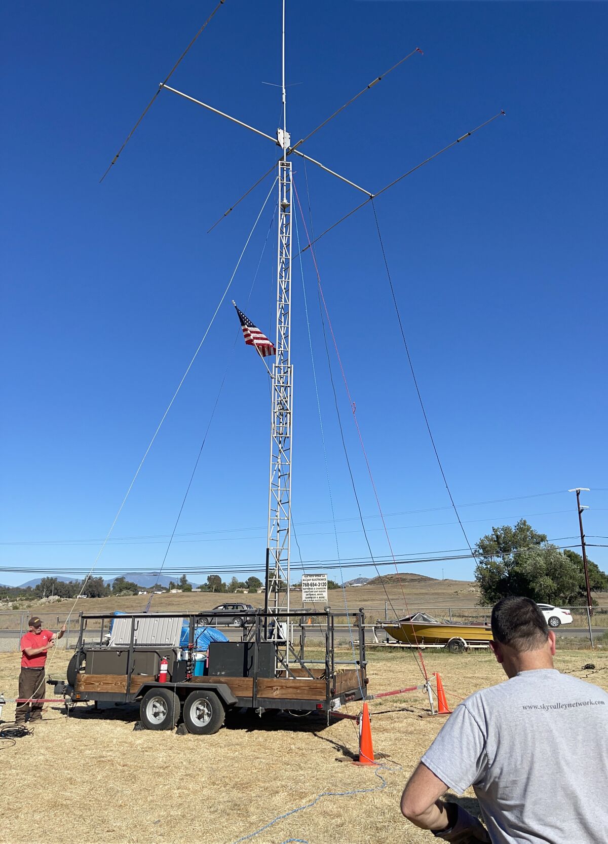 ROARS sets up a mobile communications trailer with an antenna at Amateur Radio Field Day.