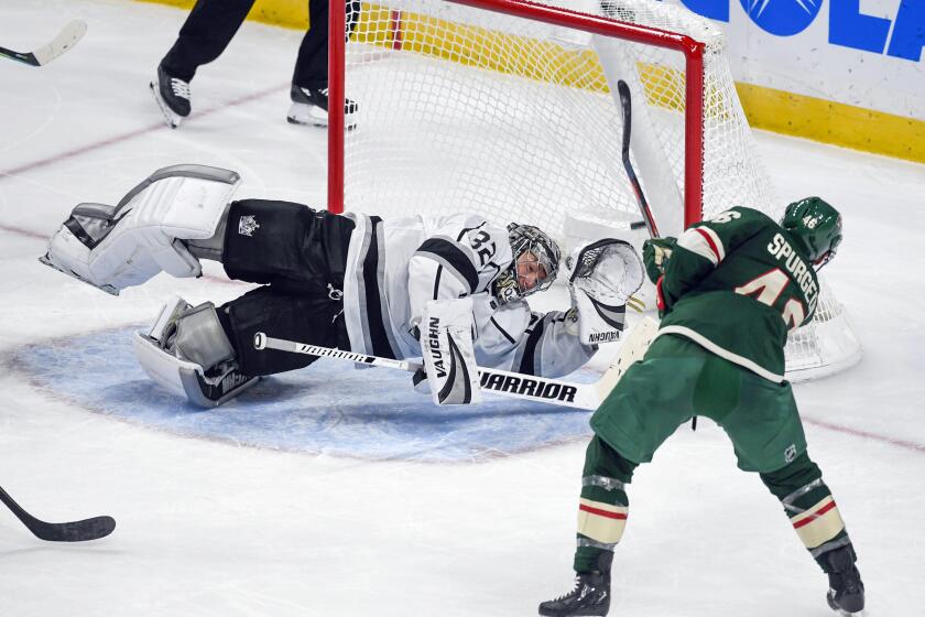 Minnesota Wild defenseman Jared Spurgeon, right, scores with a shot over the glove of Los Angeles Kings goalie Jonathan Quick (32) during the third period of an NHL hockey game Saturday, Oct. 26, 2019, in St. Paul, Minn. (AP Photo/Craig Lassig)