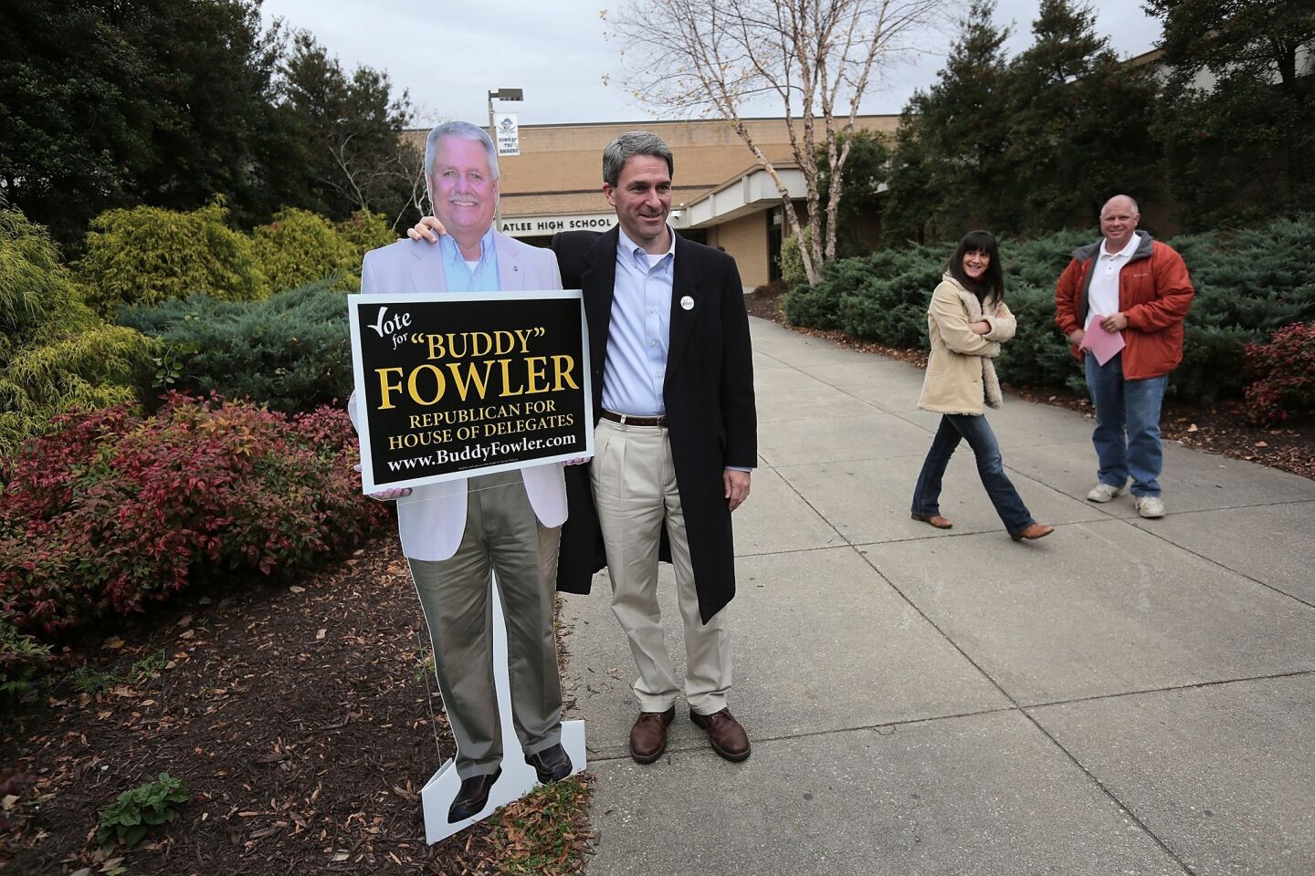 Republican gubernatorial candidate Ken Cuccinelli poses with a cardboard cutout of Virginia House of Delegates candidate Buddy Fowler while greeting voters in Mechanicsville, Va. Cuccinelli lost. Fowler won.