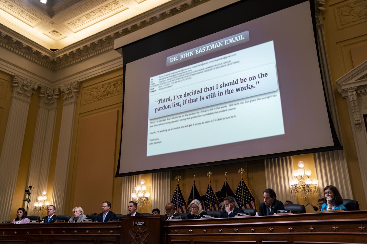 An excerpt from an email by Dr. John Eastman is displayed on a screen above the dais at a Jan. 6 hearing on June 16.