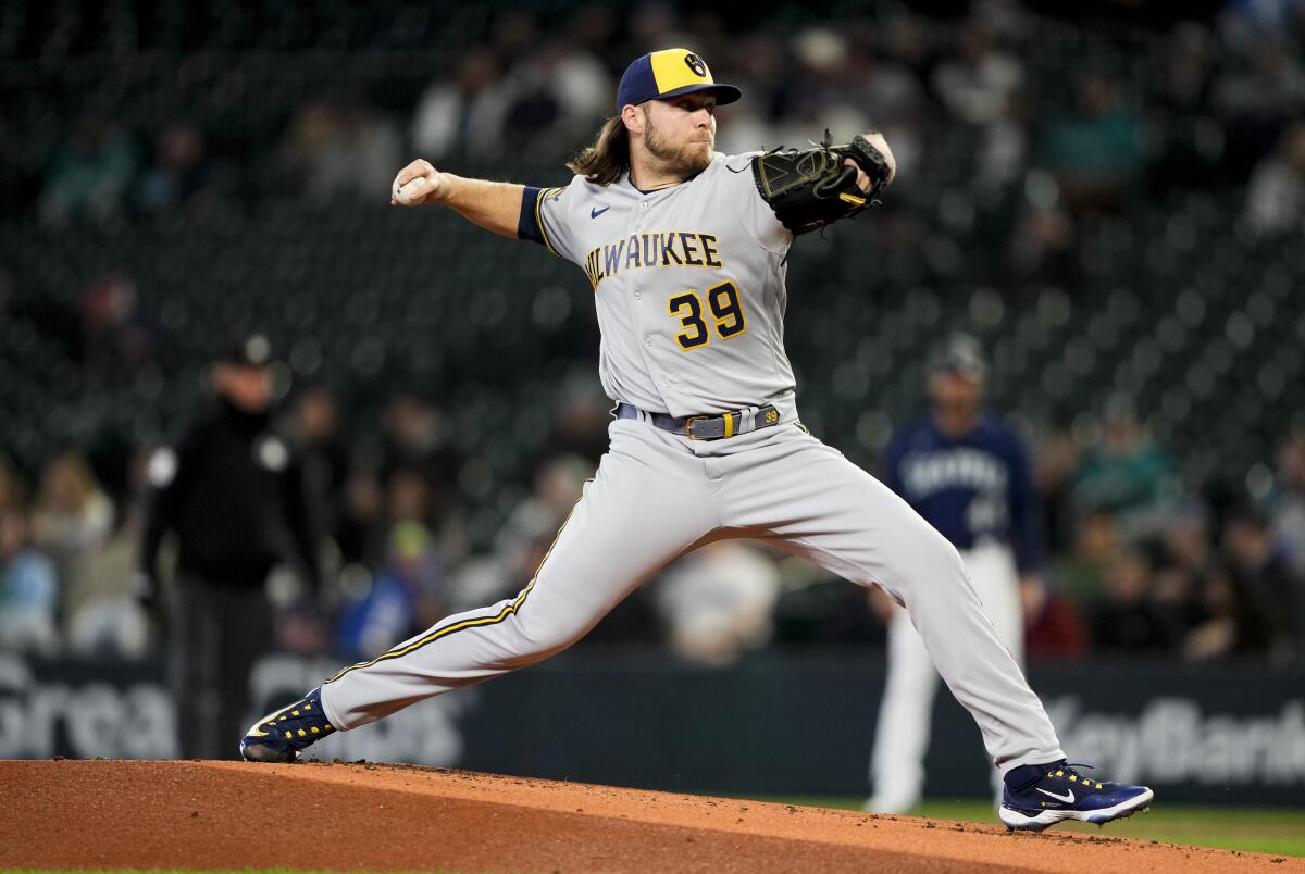 Brewers ace Corbin Burnes leaves game with pectoral strain - The San Diego  Union-Tribune