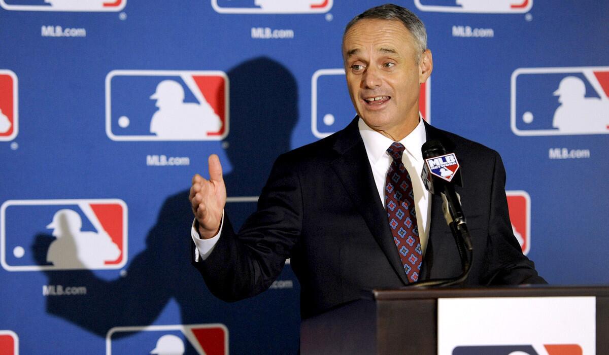 Rob Manfred, Major League Baseball's chief operating officer, speaks to reporters after team owners elected him as the next commissioner on Thursday during a meeting in Baltimore.