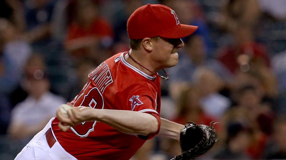 Angels reliever Joe Smith delivers a pitch during the ninth inning of the team's 8-6 victory over the Minnesota Twins on Tuesday.