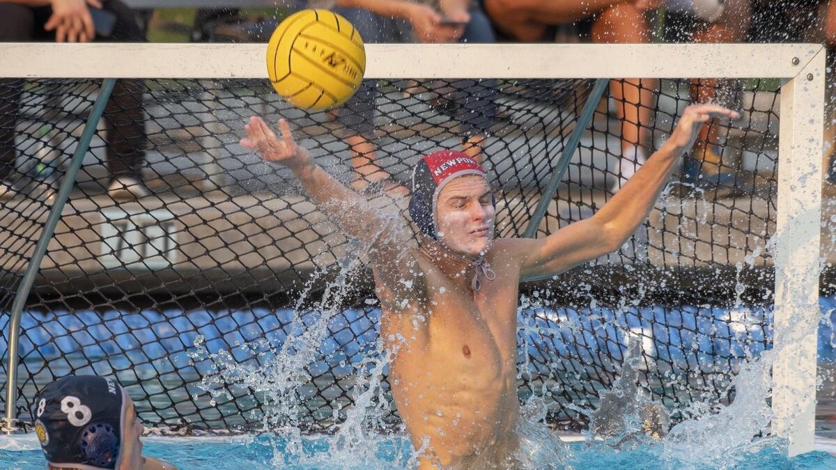 Newport Harbor High goalkeeper Blake Jackson blocks a shot during the CIF Southern Section Division 1 title match against Studio City Harvard-Westlake at Woollett Aquatics Center in Irvine on Saturday.