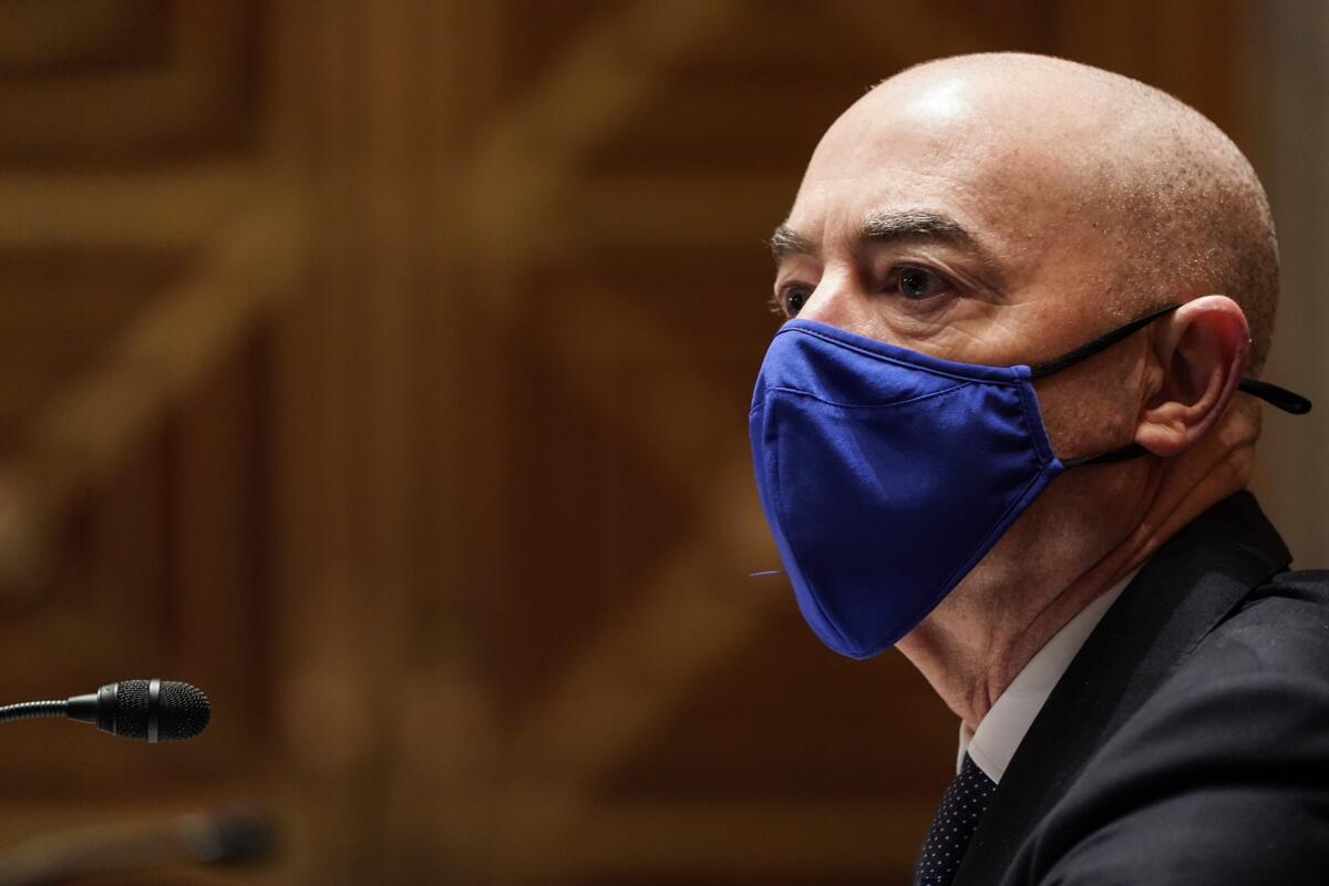 Homeland Security Secretary Alejandro Mayorkas wearing a mask.