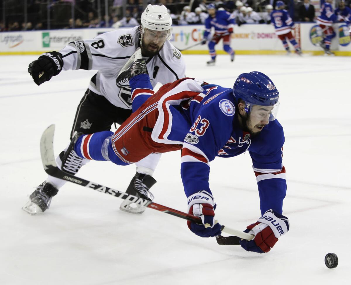 Rangers center Mika Zibanejad falls as he is tripped by Kings defenseman Drew Doughty during a Jan. 23 game at Madison Square Garden.