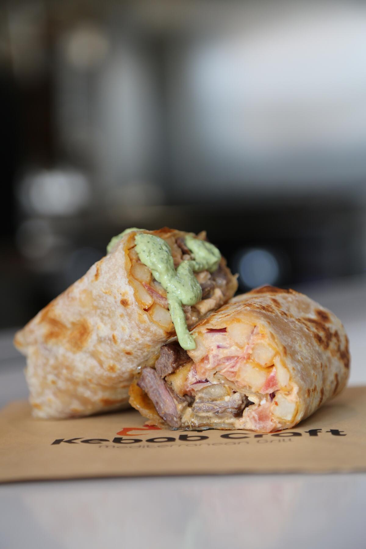 The Cali Kebab has french fries, chopped tomatoes and onions along with feta or a jack/cheddar mix, a protein and sauce.