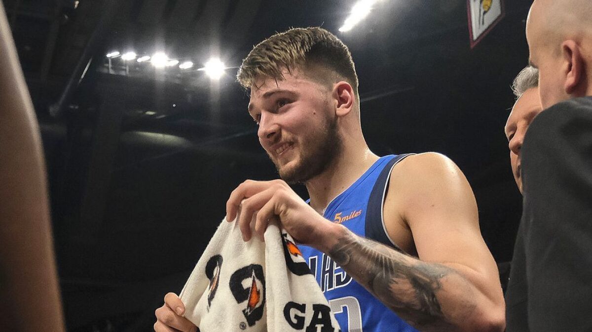 Mavericks forward Luka Doncic leaves the court Saturday in Indianapolis after being called for his second technical foul.