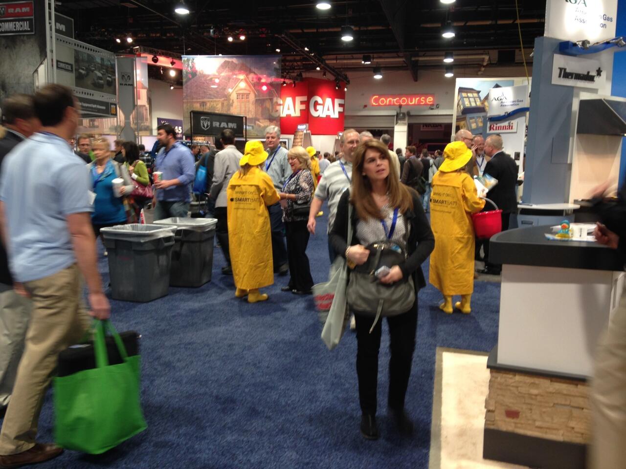 Models in rain hats, coats and boots handed out rubber ducks to promote CertainTeed's Smartbatt fiberglass insulation, which regulates moisture in walls.