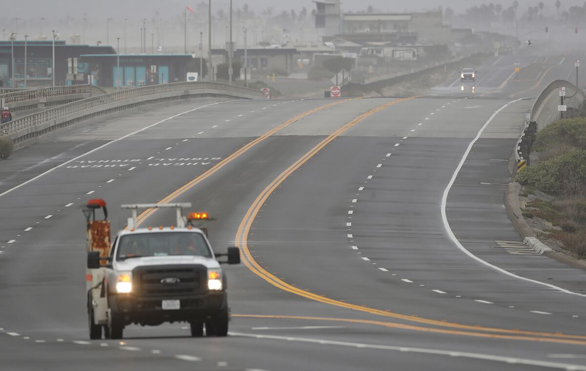 A Caltrans truck prepares to open southbound lanes on Coast Highway.
