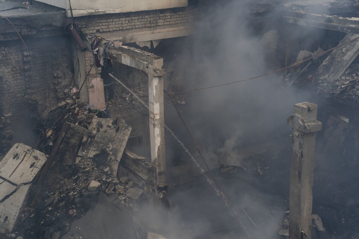 Smoke inside the ruins of a cultural center in eastern Ukraine