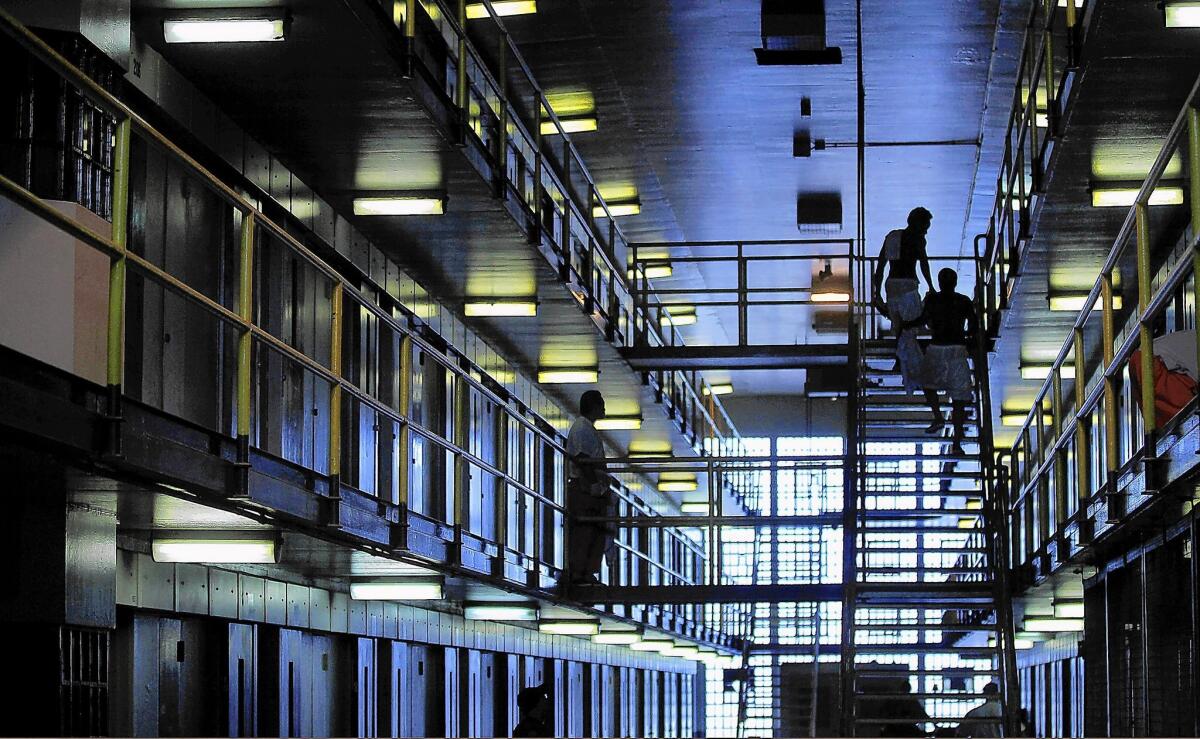 California inmates serving time for certain nonviolent crimes are being discharged days or weeks before they were scheduled to go free. Above, inmates at Deuel Vocational Institution in Tracy.