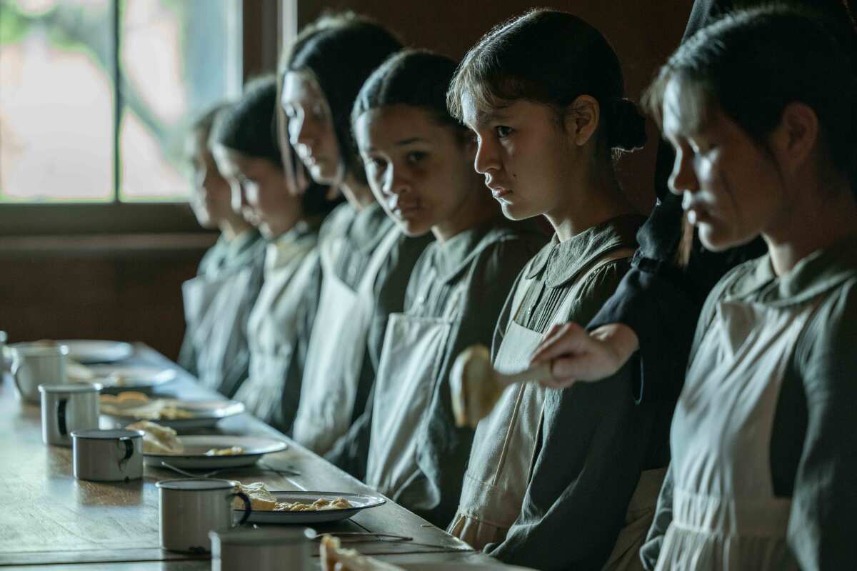 Young girls in the mess hall of an Indian boarding school 