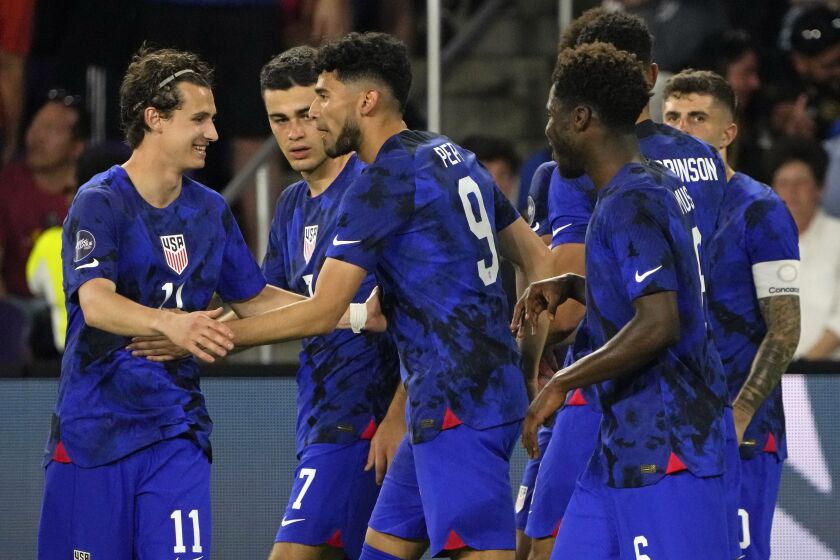 United States forward Ricardo Pepi (9) celebrates with teammates.