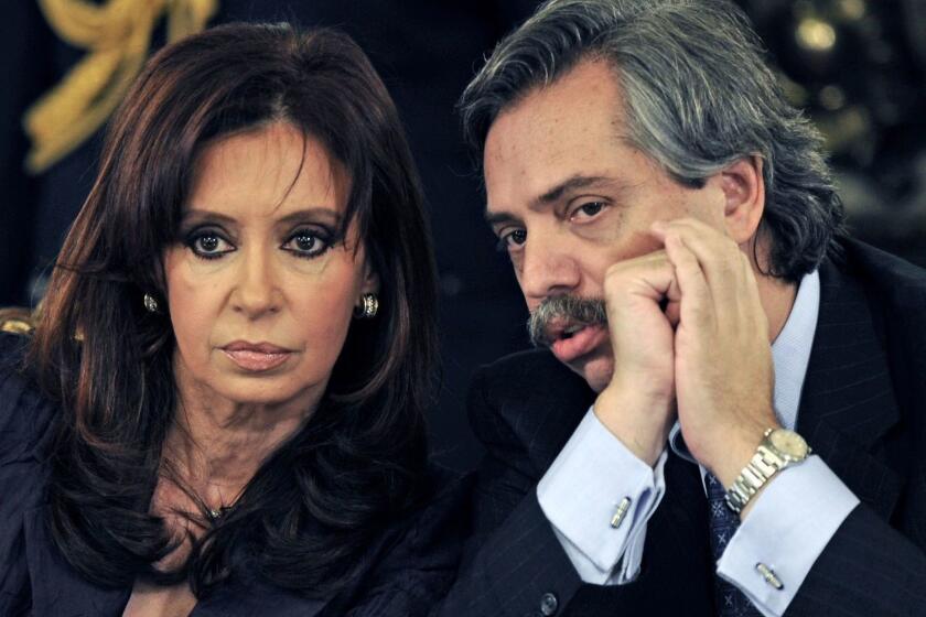 (FILES) In this file photo taken on March 31, 2008 then Argentine President Cristina Fernandez de Kirchner (L) listens to then Chief of Cabinet Alberto Fernandez before speaking about the farmer's strike against the official agricultural tax policy in Buenos Aires. - Argentine former president and current senator Cristina Fernandez de Kirchner announced on May 18, 2019 her candidacy for Vice-President, as running mate of her former Chief of Staff Alberto Fernandez, for the October 27 general elections in Argentina. (Photo by DANIEL GARCIA / AFP)DANIEL GARCIA/AFP/Getty Images ** OUTS - ELSENT, FPG, CM - OUTS * NM, PH, VA if sourced by CT, LA or MoD **