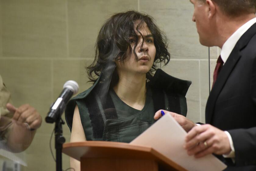 Carlos Dominguez, middle, appears during his arraignment hearing Friday  at Yolo County Superior Court in Woodland.