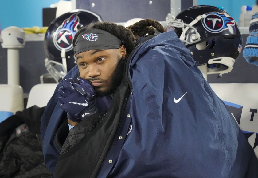 Tennessee Titans running back D'onta Foreman sits on the bench after the team's 19-16 loss to the Cincinnati Bengals in an NFL football AFC divisional playoff game Saturday, Jan. 22, 2021, in Nashville, Tenn. (George Walker IV/The Tennessean via AP)